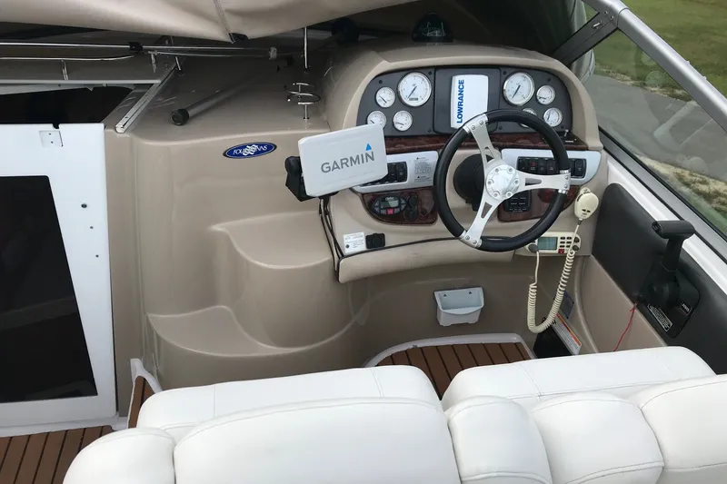 Slide: The Image of 2007 Four Winns 278 Vista boat cockpit with Garmin navigation and steering wheel. - 13