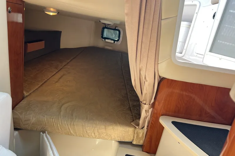Slide: The Image of Interior cabin of 2007 Four Winns 288 Vista boat with bed and window. - 18