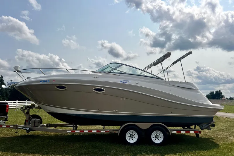 Slide: The Image of 2007 Four Winns 288 Vista boat on trailer under cloudy sky. - 1