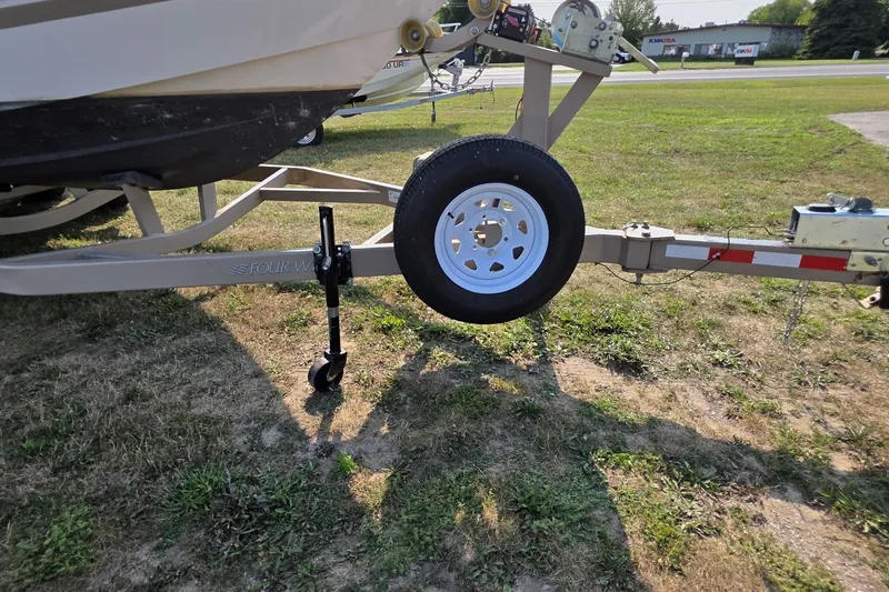 Slide: The Image of Trailer of 2007 Four Winns 288 Vista boat on grassy area. - 24
