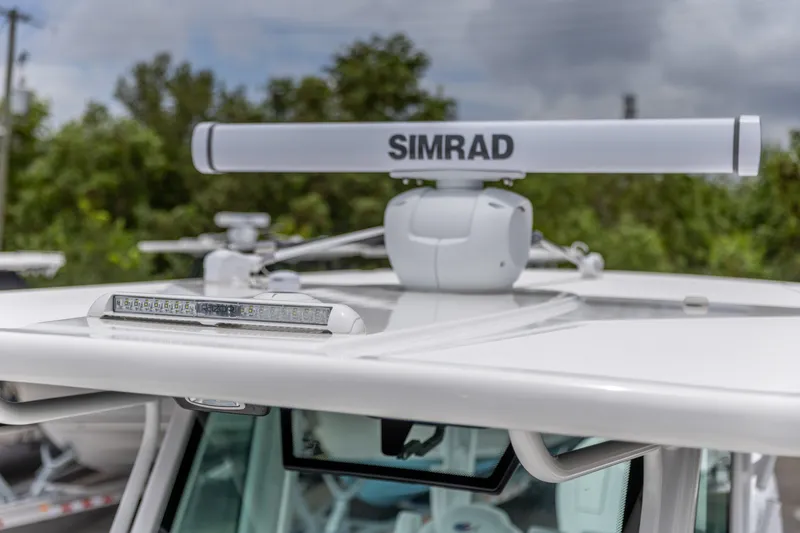 Slide: The Image of 2026 Crevalle 33 CSF boat with Simrad radar system on the roof. - 23