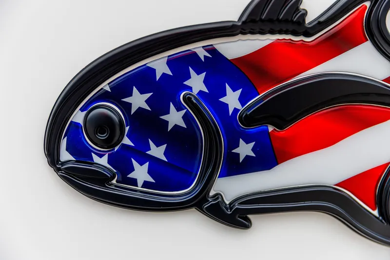 Slide: The Image of American flag-themed fish design on 2026 Crevalle 33 CSF boat. - 44