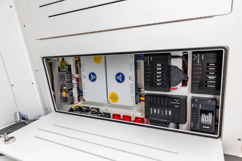 Slide: The Image of Electrical panel inside 2026 Crevalle 33 CSF boat, showcasing wiring and components. - 38