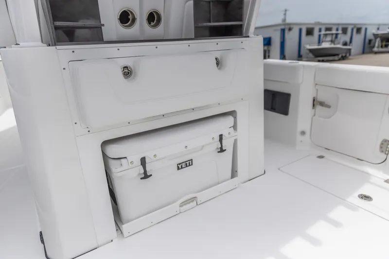 Slide: The Image of Crevalle 33 CSF 2026 boat interior with Yeti cooler storage compartment. - 18
