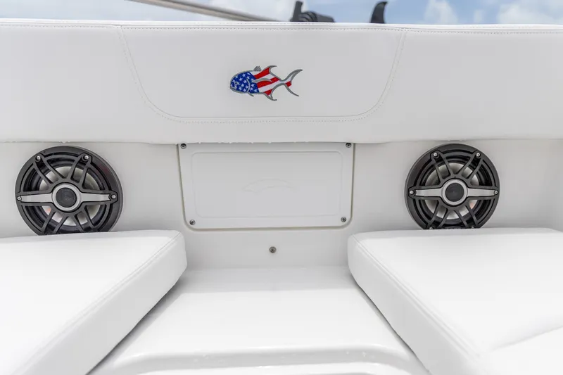Slide: The Image of 2026 Crevalle 33 CSF boat interior with speakers and American flag fish emblem. - 35