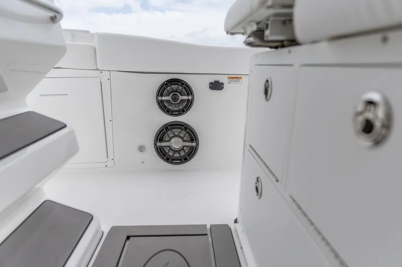 Slide: The Image of 2026 Crevalle 33 CSF boat interior with speakers and storage compartments. - 25