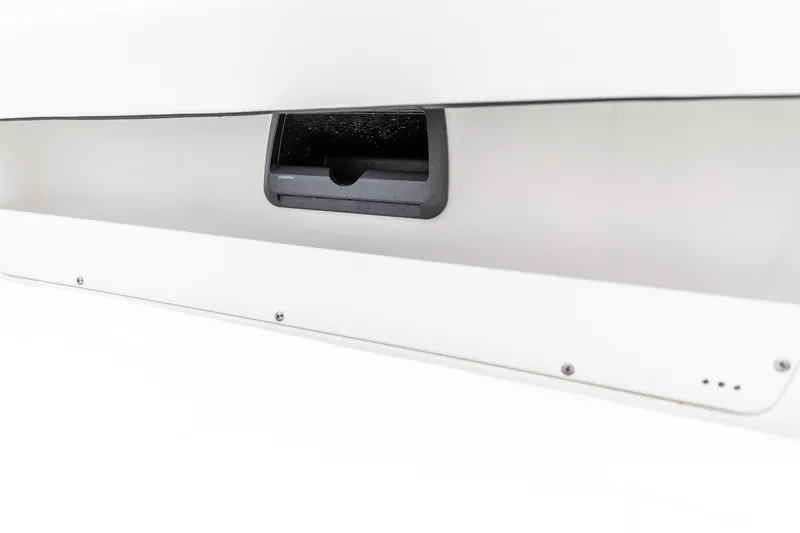 Slide: The Image of 2026 Crevalle 33 CSF boat storage compartment with sleek design and secure latch. - 34