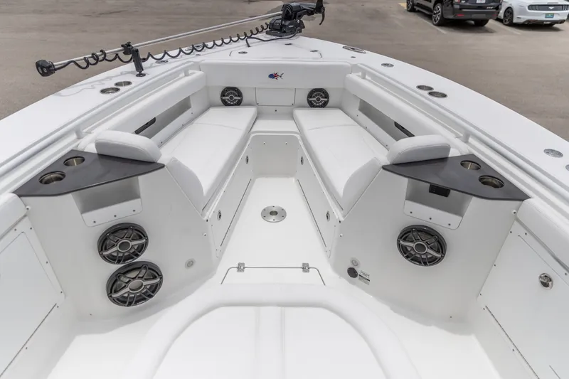 Slide: The Image of 2026 Crevalle 33 CSF boat interior with seating, cup holders, and speakers. - 1