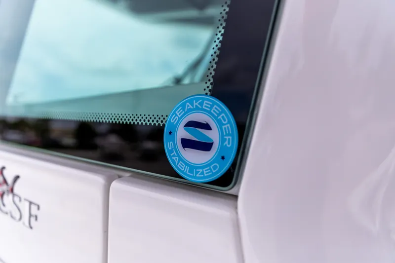 Slide: The Image of 2026 Crevalle 33 CSF boat with Seakeeper stabilization sticker on window. - 8