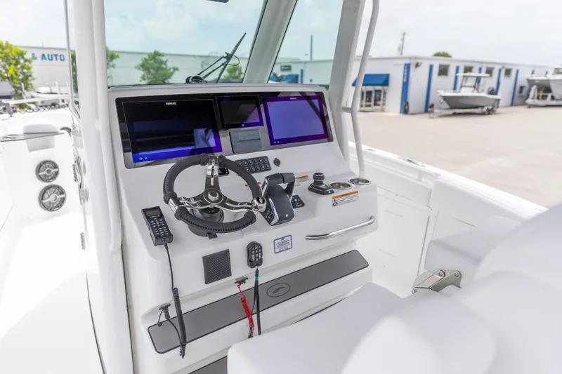 Slide: The Image of 2026 Crevalle 33 CSF boat dashboard with advanced navigation and control systems. - 2