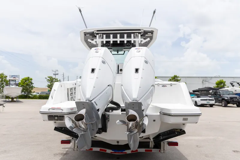 Slide: The Image of 2026 Crevalle 33 CSF boat with dual outboard engines, rear view. - 10