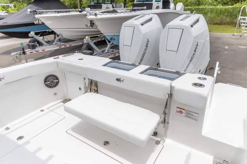 Slide: The Image of 2026 Crevalle 33 CSF boat with dual Mercury engines, featuring a spacious deck and seating area. - 9