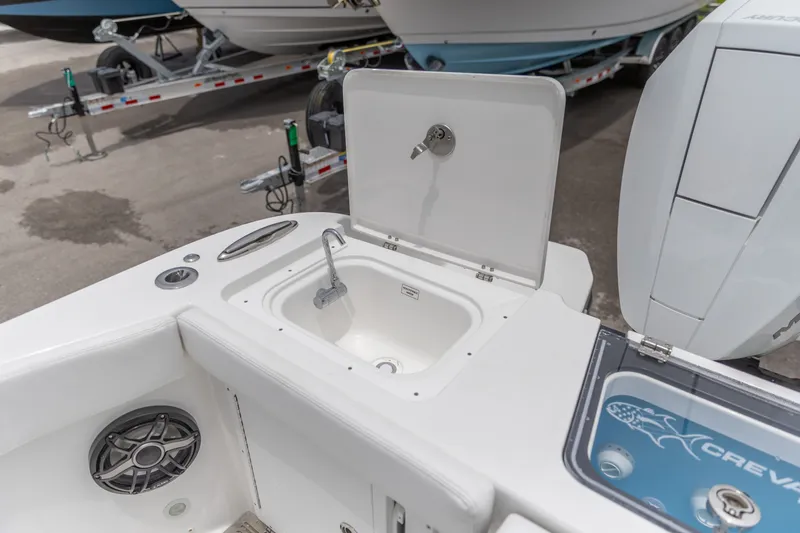 Slide: The Image of Crevalle 33 CSF 2026 boat sink and storage area with open lid. - 15