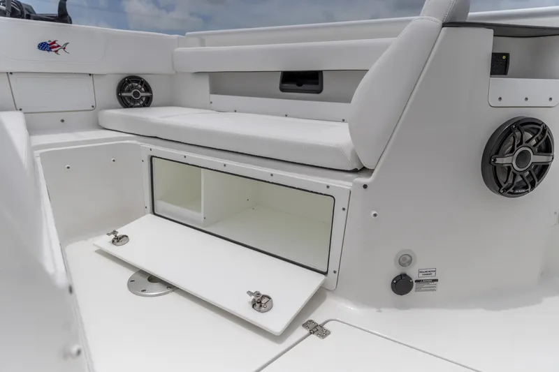 Slide: The Image of 2026 Crevalle 33 CSF boat interior with storage compartment and seating. - 33