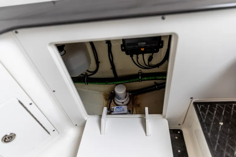 Slide: The Image of 2026 Crevalle 33 CSF boat compartment showing internal wiring and components. - 39