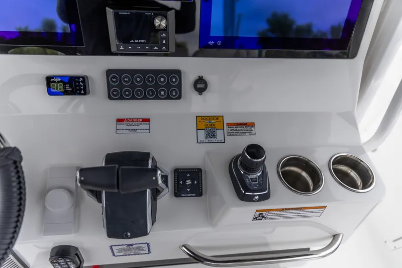 Slide: The Image of Control panel of 2026 Crevalle 33 CSF boat with modern navigation and audio systems. - 27