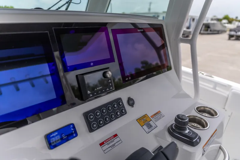Slide: The Image of Dashboard of 2026 Crevalle 33 CSF boat with advanced navigation displays. - 26