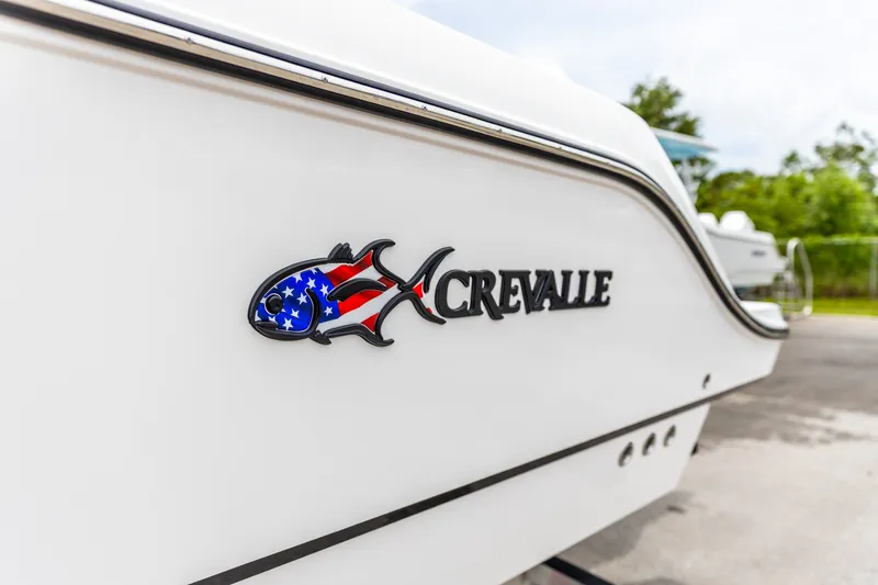 Slide: The Image of 2026 Crevalle 33 CSF boat with American flag fish logo on the side. - 42