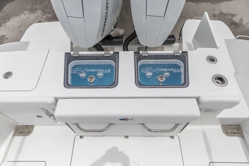 Slide: The Image of 2026 Crevalle 33 CSF boat deck with dual Mercury engines and branded compartments. - 16