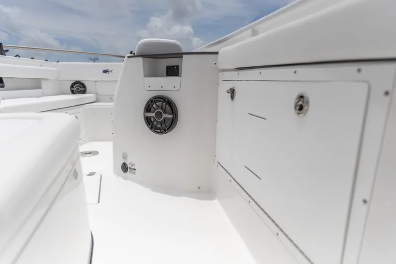 Slide: The Image of 2026 Crevalle 33 CSF boat interior with speaker and storage compartments. - 30