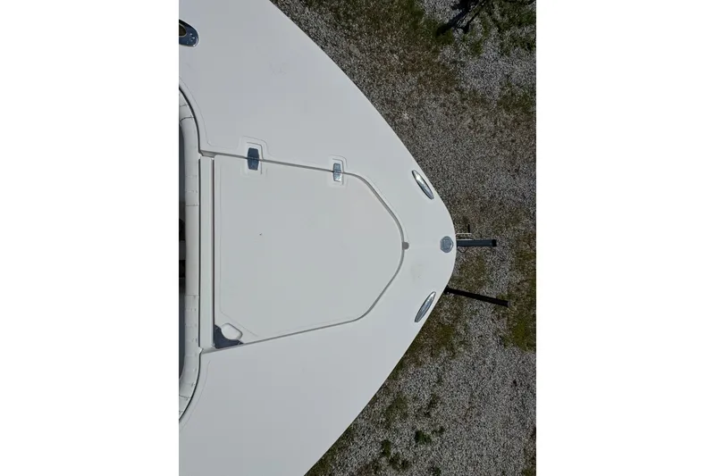 Slide: The Image of Top view of a 2013 Southport 27 FE boat's bow on gravel. - 48