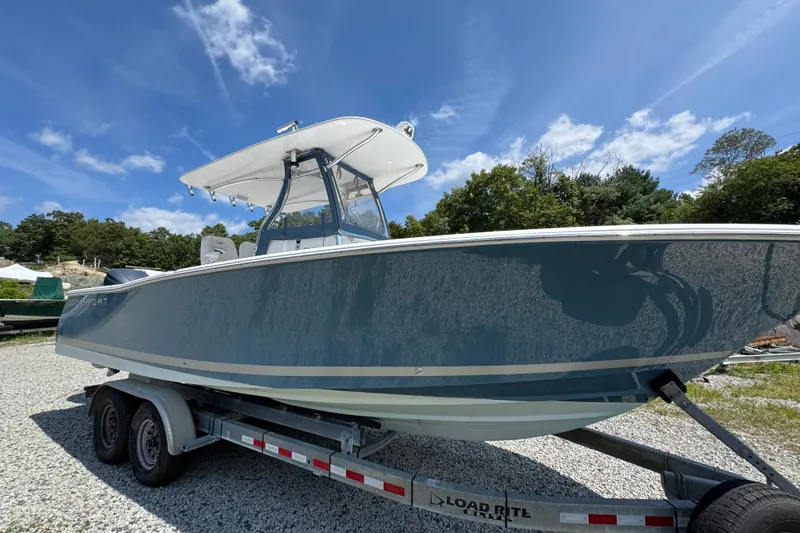 Slide: The Image of 2013 Southport 27 FE boat on trailer under clear blue sky. - 8