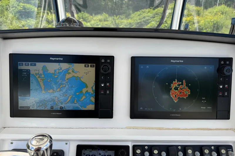 Slide: The Image of Raymarine navigation displays on 2013 Southport 27 FE boat dashboard. - 23