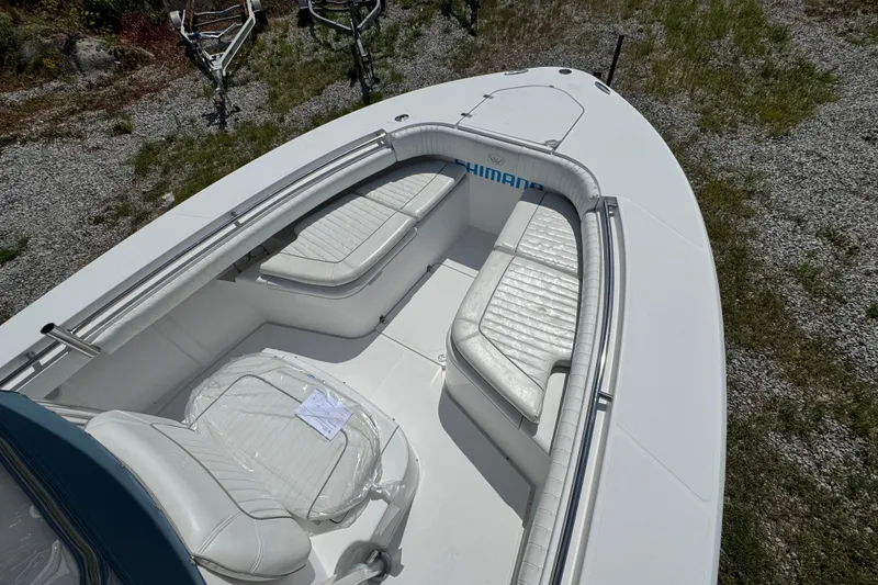 Slide: The Image of 2013 Southport 27 FE boat with white seating and open deck layout. - 41
