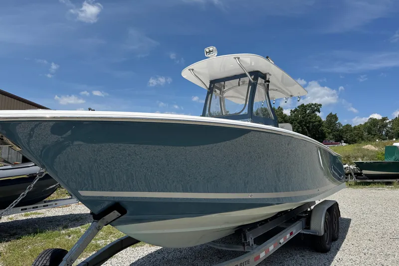 Slide: The Image of 2013 Southport 27 FE boat on trailer under clear blue sky. - 6