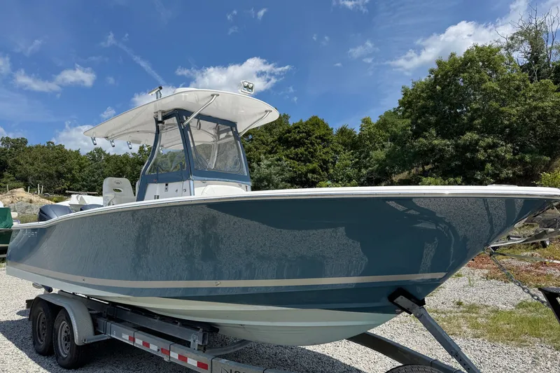 Slide: The Image of 2013 Southport 27 FE boat on trailer under clear blue sky. - 9