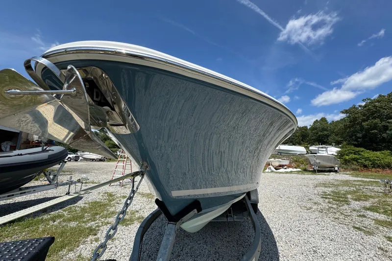 Slide: The Image of 2013 Southport 27 FE boat on trailer under clear blue sky. - 44