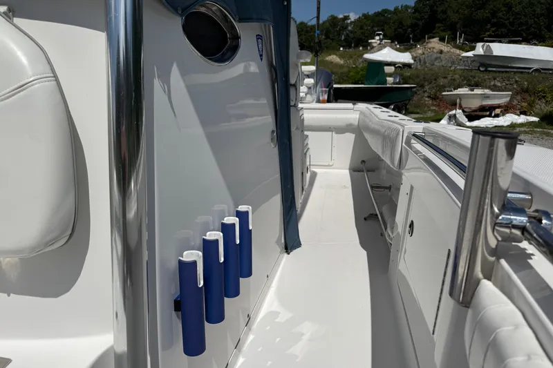 Slide: The Image of 2013 Southport 27 FE boat interior with rod holders and seating. - 36