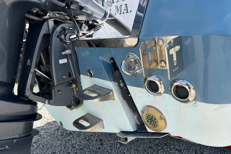 Slide: The Image of Close-up of a 2013 Southport 27 FE boat's stern with engine and fittings. - 47