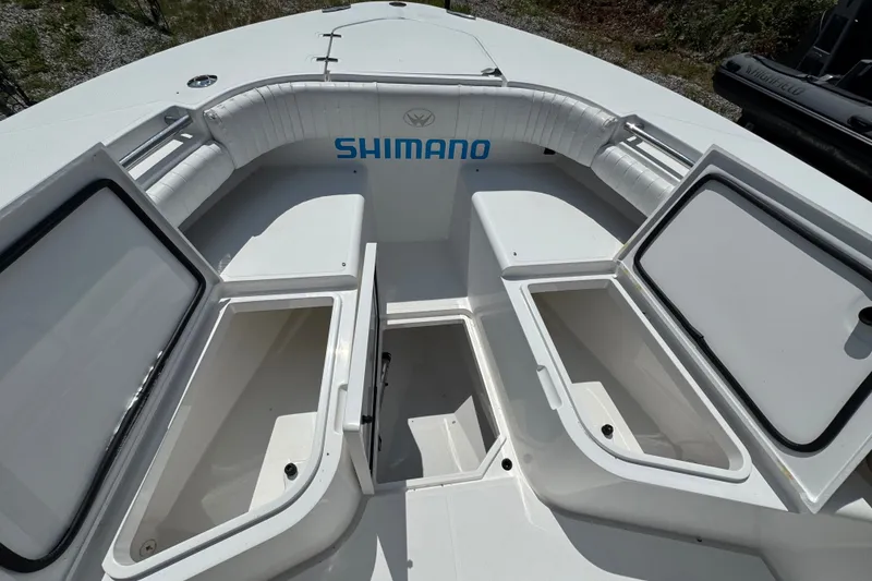 Slide: The Image of 2013 Southport 27 FE boat interior with open storage compartments and seating. - 39