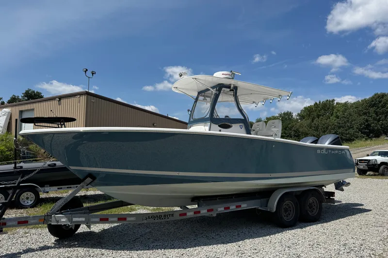 Slide: The Image of 2013 Southport 27 FE boat on trailer under clear blue sky. - 3