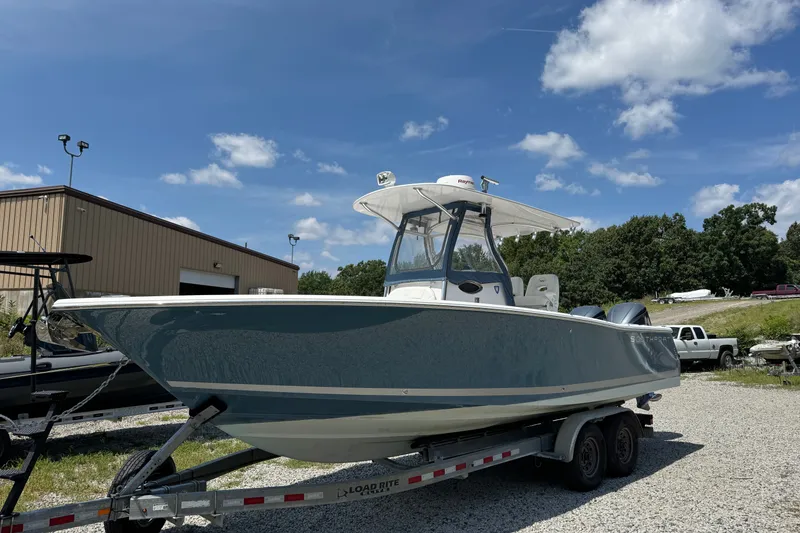 Slide: The Image of 2013 Southport 27 FE boat on trailer under clear blue sky. - 5