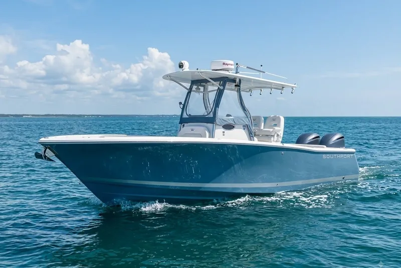 The Image of 2013 Southport 27 FE boat cruising on open ocean under clear skies. - 0