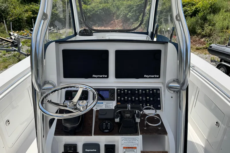 Slide: The Image of Control console of a 2013 Southport 27 FE boat with Raymarine displays. - 18