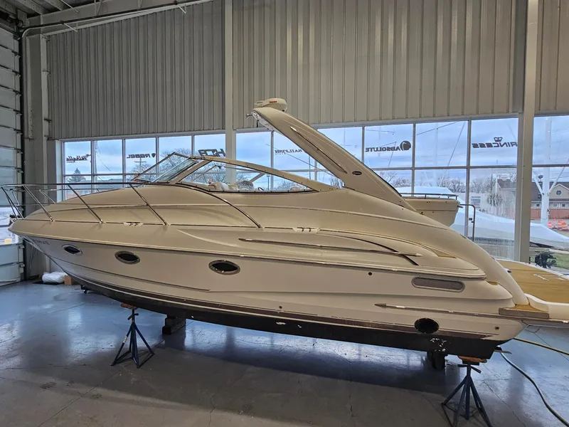 The Image of A 2001 Doral 330se is on stands in a warehouse. It features a sleek design. - 0