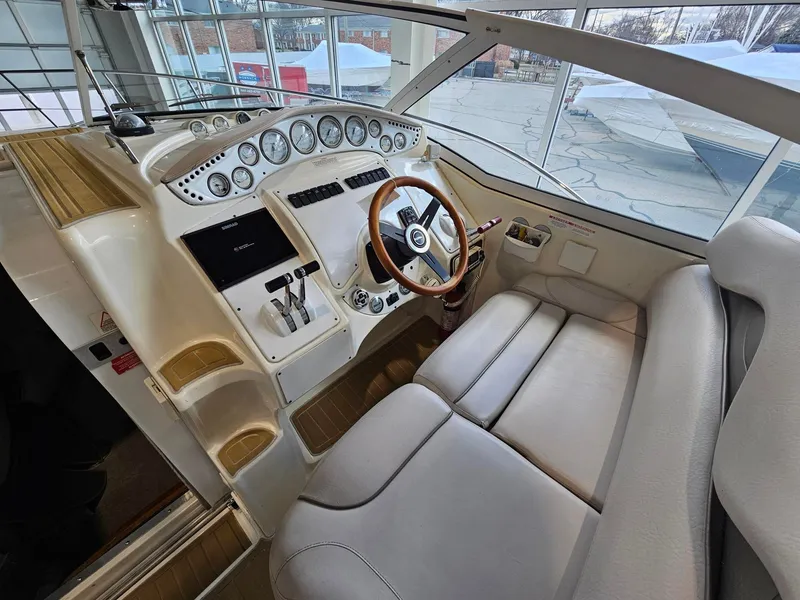 Slide: The Image of The image shows the cockpit of a 2001 Doral 330se with a sleek wooden steering wheel and modern instruments. - 4