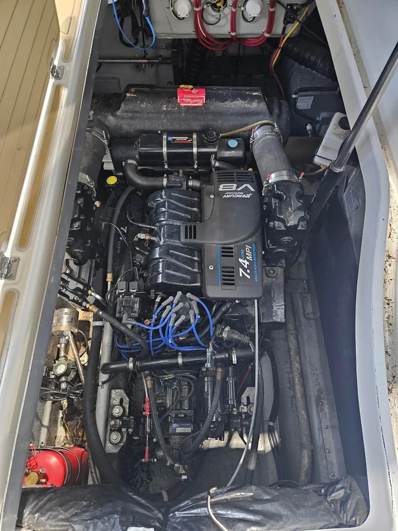 Slide: The Image of The engine compartment of a 2001 Doral 330se shows a well-maintained engine with various components and wires. - 11