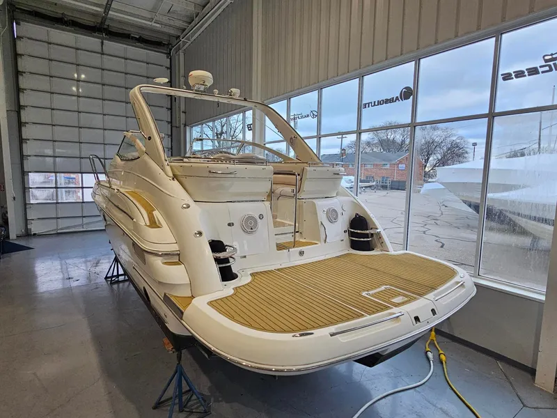 Slide: The Image of A 2001 Doral 330se is in a showroom. It features a spacious aft deck. - 5
