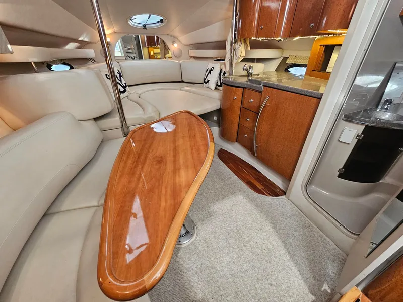 Slide: The Image of Interior of a 2001 Doral 330se with elegant wood paneling and comfortable seating. - 3