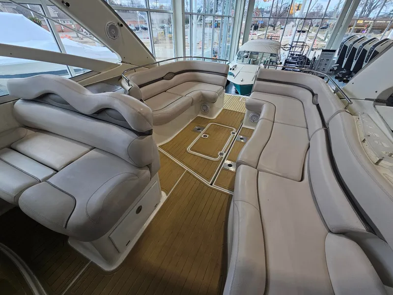 Slide: The Image of The image shows the spacious cockpit of a 2001 Doral 330se with beige upholstered seating. - 1