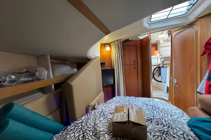 Slide: The Image of Cozy interior of 2020 Ranger Tugs R-31 CB boat cabin with bed and storage. - 30