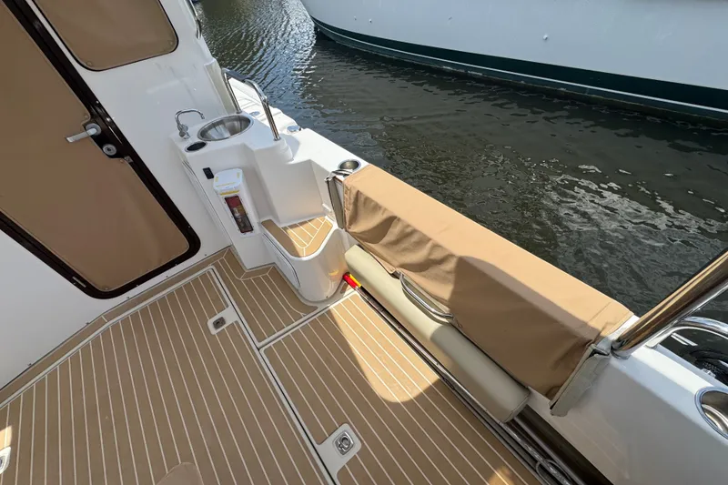 Slide: The Image of 2020 Ranger Tugs R-31 CB boat deck with sink and seating area. - 9