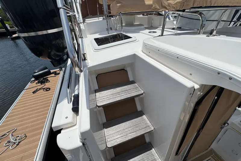 Slide: The Image of 2020 Ranger Tugs R-31 CB boat with wooden steps and sleek deck design. - 11