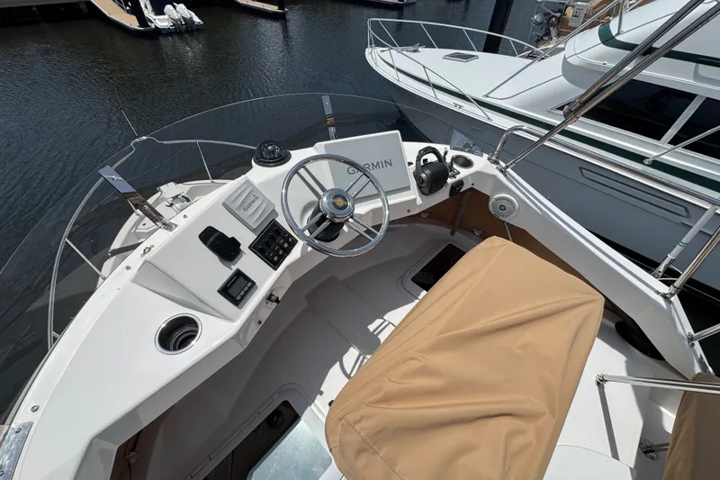 Slide: The Image of Cockpit view of 2020 Ranger Tugs R-31 CB boat with Garmin navigation system. - 14