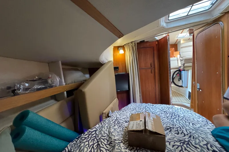 Slide: The Image of Interior of 2020 Ranger Tugs R-31 CB boat cabin with bed and storage. - 29