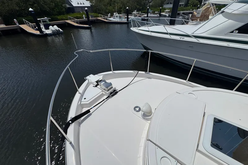 Slide: The Image of Bow view of a 2020 Ranger Tugs R-31 CB docked in a marina. - 32